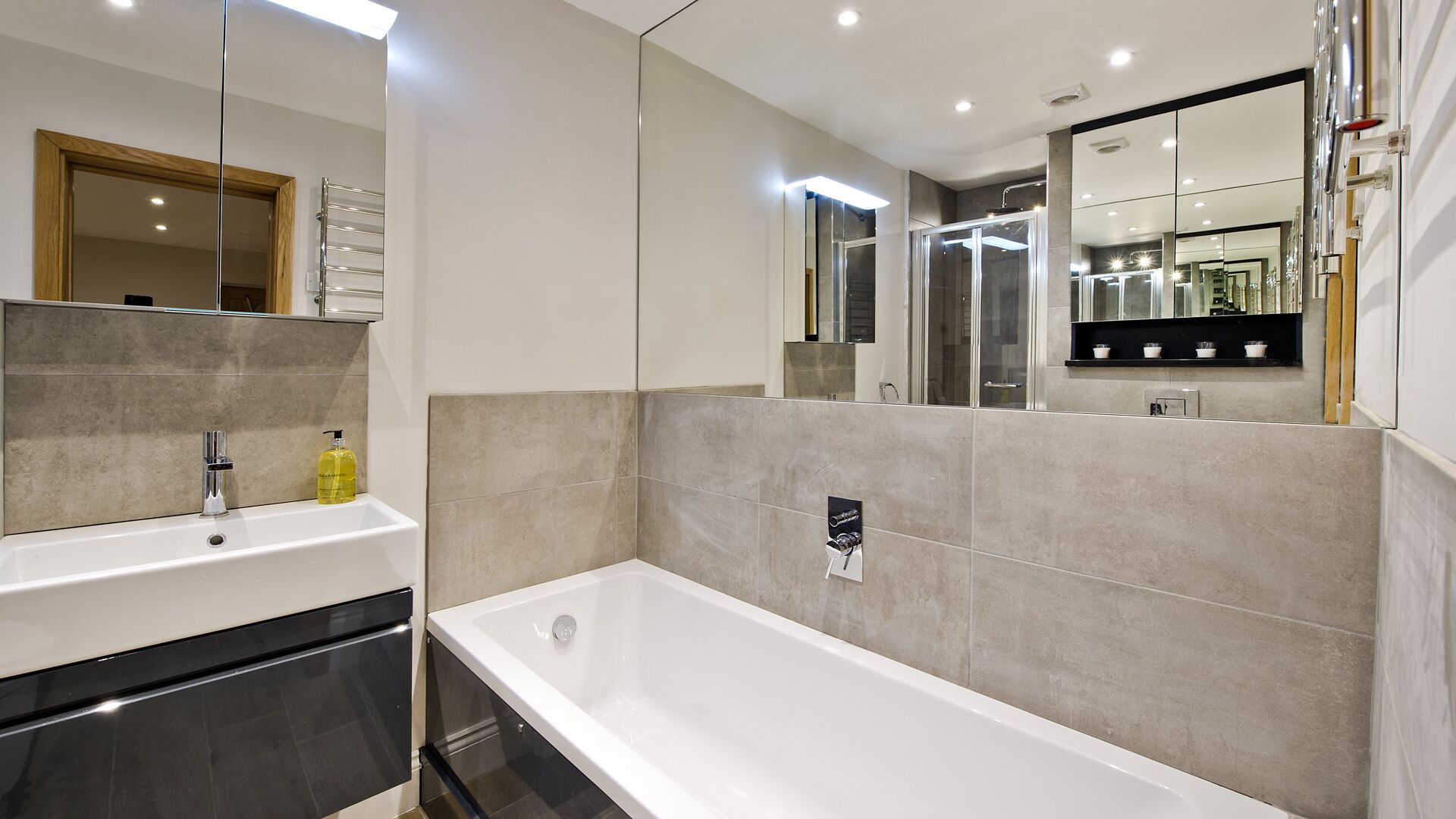 Bathtub, hair dryer, towels, soap