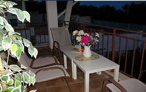 Enjoy al fresco dining with a scenic view of the water from this balcony.