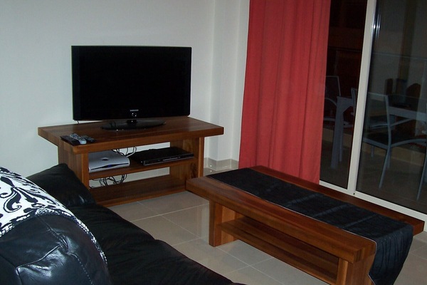 THE LIVING ROOM WITH PATIO DOOR TO THE BALCONY