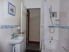 Combined shower/bathtub, hair dryer, towels, soap