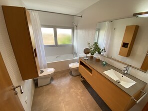 Bathtub, hair dryer, towels