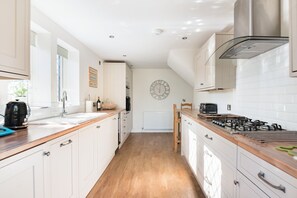 Fridge, microwave, oven, stovetop - A beautifully furnished, stone cottage in Swanage with garden and parking. (Swanage)
