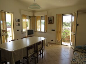 Enjoy meals in the dining area with a table and chairs, and relax in the comfort of your own space.