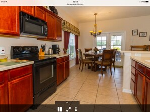 Enjoy family meals in a well-appointed kitchen with a central island and ample counter space.