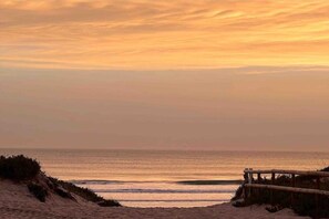 On the beach, sun-loungers