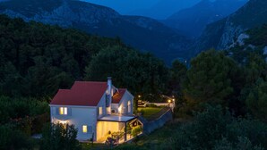 A modern house with a red roof, surrounded by lush greenery and mountains in the background. - Villa PROVOS with 40m2 private pool, sauna, max 8 person, 7km from sandy beach (TUGARE)