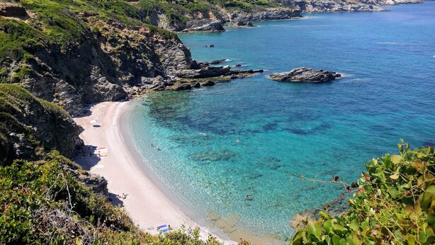 A coastal landscape with a clear beach, rocky cliffs, and dense greenery. -  Pool Villa Perivoliou walking distance to 4 beaches, near Mamma Mia Church (Northern Sporades)