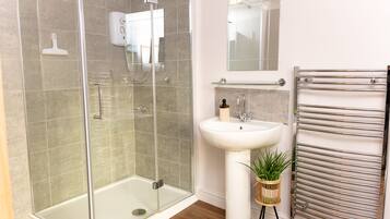 Bathtub, hair dryer, towels, soap