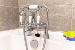 Bathtub, hair dryer, towels, soap