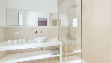 Combined shower/tub, hair dryer, towels, toilet paper