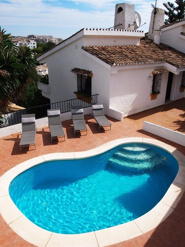 Enchanting villa with private pool and stunning views, close to beach.