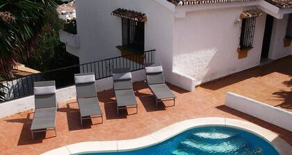 Enchanting villa with private pool and stunning views, close to beach.