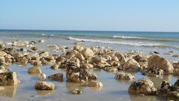 On the beach, sun loungers