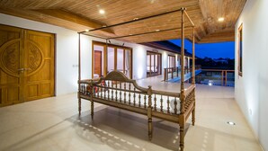 A spacious room with a four-poster bed, wooden ceiling, and large doors. - Golf Resort /Villa in Hua Hin, Palm Hills Golf Resort (Tambon Hua Hin)
