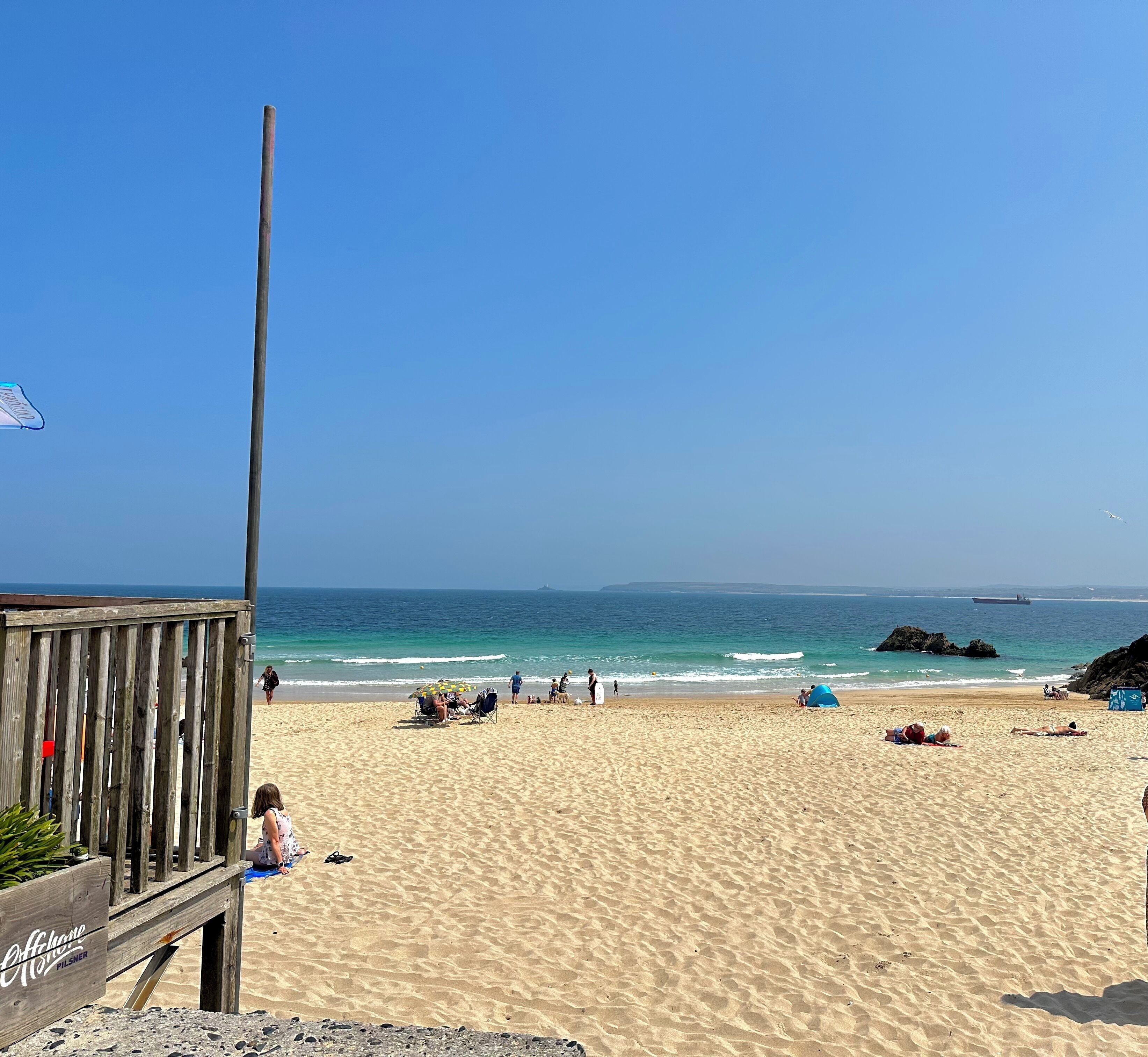 On the beach, sun-loungers