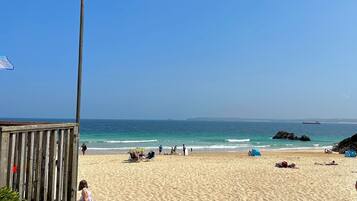 On the beach, sun-loungers