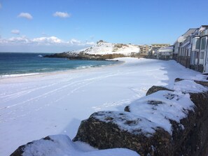 On the beach, sun-loungers