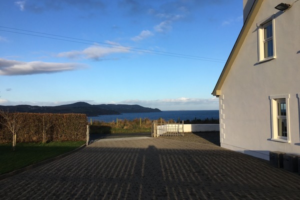 Entrance gate. View of Culdaff bay in the distance.