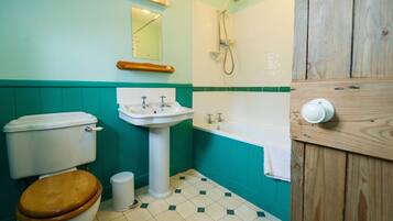 Combined shower/bathtub, hair dryer, towels, soap