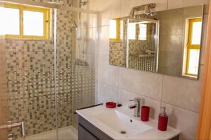 Combined shower/tub, hair dryer, towels, toilet paper