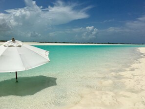On the beach, sun-loungers, beach towels