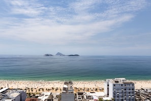 A coastal cityscape with a beach, buildings, and clear skies. - Heart of Ipanema, stylish apartment in full service building. IDEAL LOCATION! (Rio de Janeiro)