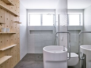 A modern bathroom with a large sink, toilet, and shower area. - Your "Boutique" Home with views!! (La Orotava)