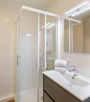 Hair dryer, towels, soap, shampoo