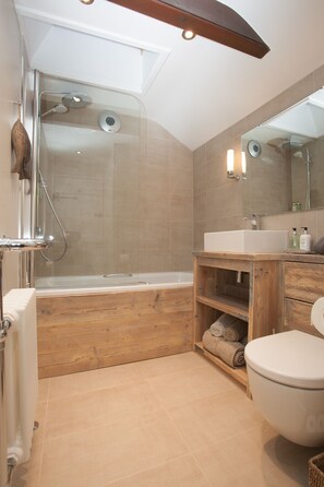 Combined shower/tub, hair dryer, towels, soap