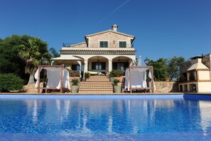 A large, two-story house with a swimming pool in front. - Luxury Villa with pool,BBQ. Swings ,Gym, Jacuzzi, Pool table,foosball,ping-pong (Palma de Mallorca)