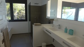Combined shower/tub, hair dryer, towels, soap