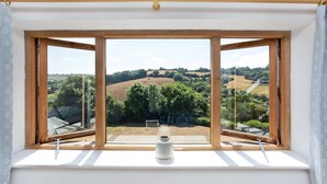A room with a large window overlooking a rural landscape. - Large Luxury House with Heated Pool, Hot Tub, Cinema close to coast near Shaldon (Stokeinteignhead)