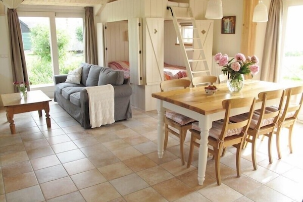The lounging area, bedstead and dinner table