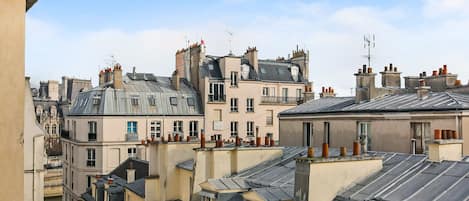A view of a densely packed urban area with multiple buildings, including residential and commercial structures.