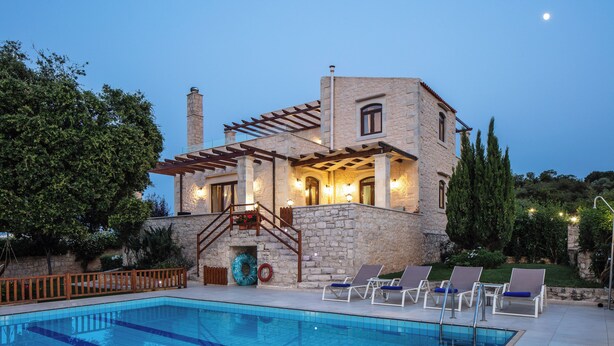 A stone building with a pool and lounge chairs. - Stone Made villa in picturesque village! Private pool & full privacy! (Rethymno)