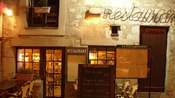 A restaurant with a stone facade, outdoor seating, and a chalkboard menu. - Air-Conditioned Cottage With Pool in Vence. (Vence)