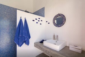 Combined shower/tub, hair dryer, towels, soap