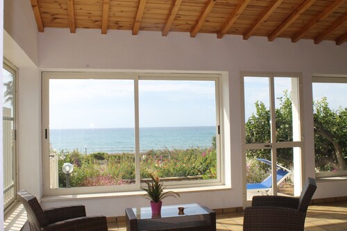 Villa Sara, an air-conditioned veranda overlooking the sea. 