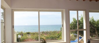 Villa Sara, an air-conditioned veranda overlooking the sea. 