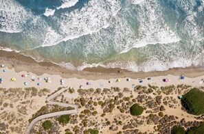 On the beach, sun-loungers, beach towels