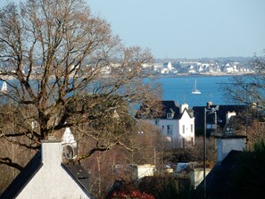 A coastal town with buildings overlooking a body of water.