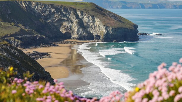 A coastal landscape with cliffs, a sandy beach, and the ocean. - Luxury House With Magnificent Sea Views (Tintagel)