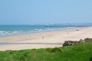 On the beach, sun-loungers, beach towels