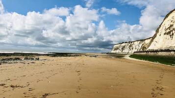 On the beach, sun-loungers, beach towels