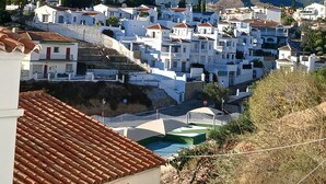 A coastal town with white buildings, terracotta roofs, and a clear blue sky. - Modern, Spacious, and Well Equipped Apartment With Mountain And Sea Views (Nerja)