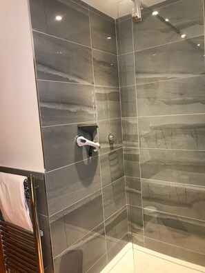 Bathtub, hair dryer, towels, soap