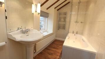 Combined shower/bathtub, hair dryer, towels, soap