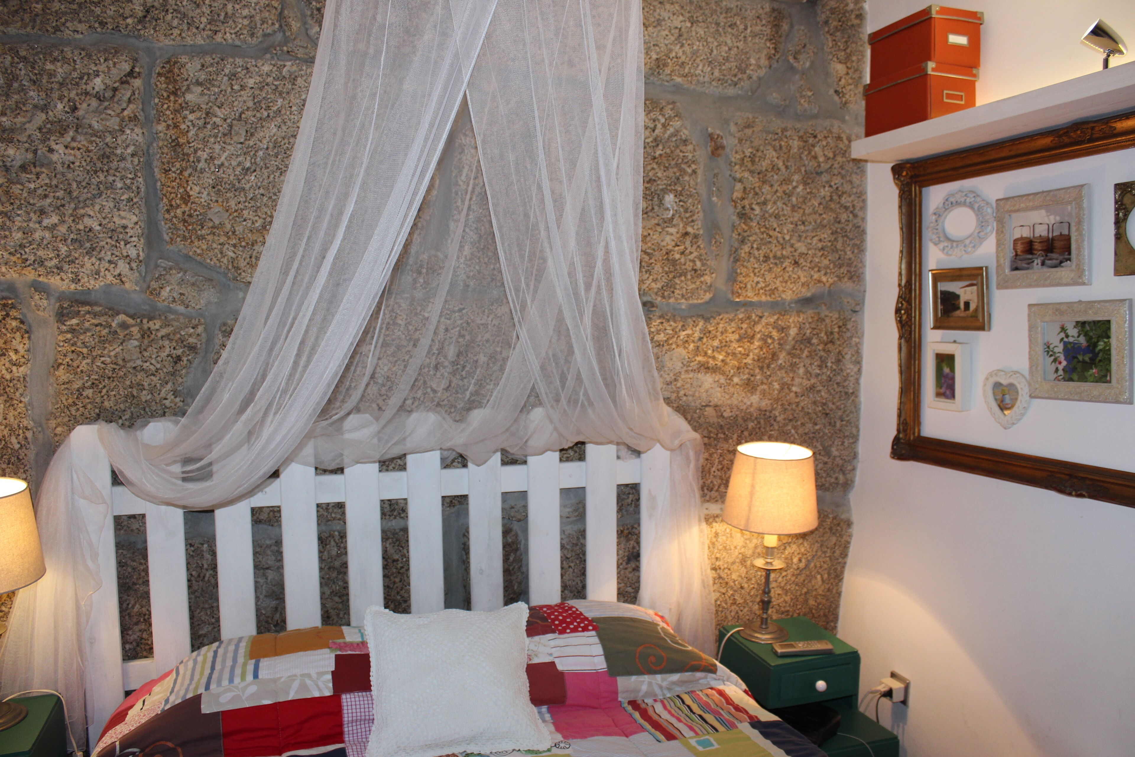 Old stone house with swimming pool and river.