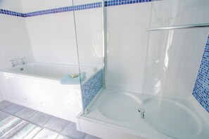 Bathtub, hair dryer, towels, soap