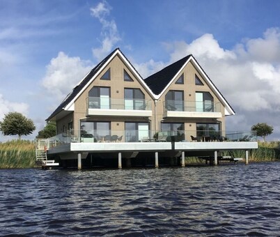 Pfahlhaus Perle am Yachthafen Carolinensiel Harlesiel ❤️, Living on the water